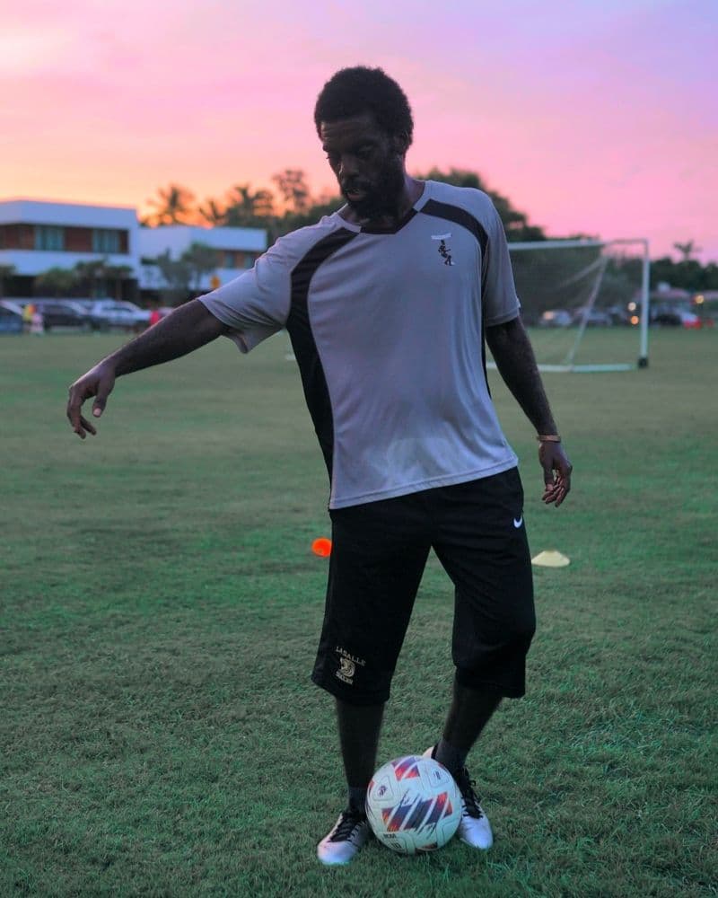 Marcus on the field at sunset